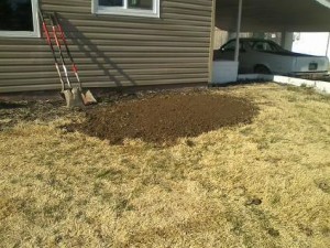 A trench that has been filled in on a residential property.